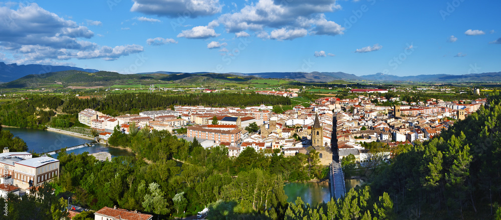 Panorama of Sanguesa city in Spanish Navarre. Aragon river and the city entrance via the bridge are at foreground   
