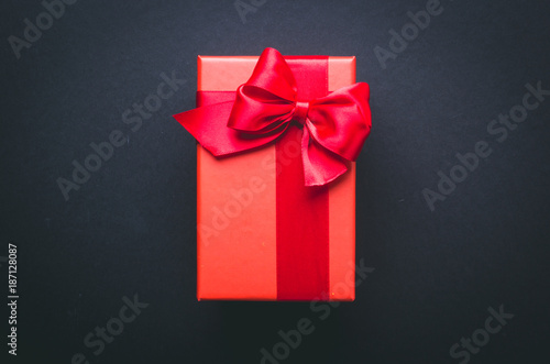 red gift box on a black background