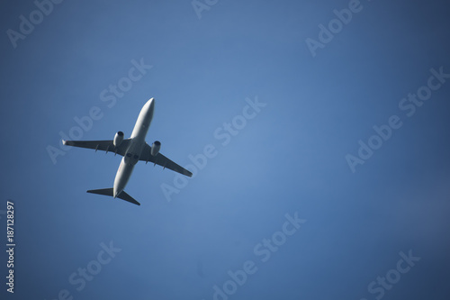 Leiden, Zuid-Holland/The Netherlands - October 28th 2017: lone white airplaine flying in the sky on a clear blue day