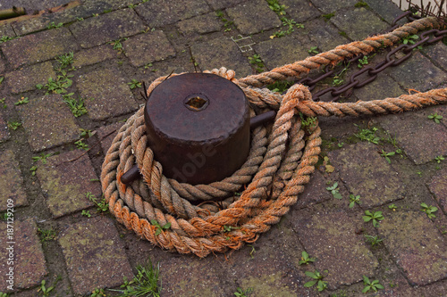 rope on a mooring bolard, closeup photo