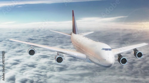 Passenger plane flying in the sky above the clouds.