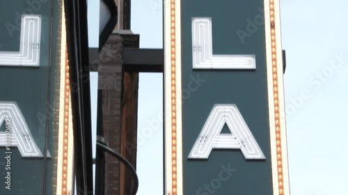 Camera tilt down on iconic Portland sign in downtown. photo