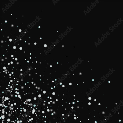 Beautiful falling snow. Scattered bottom left corner with beautiful falling snow on black background. Ravishing Vector illustration. © Begin Again