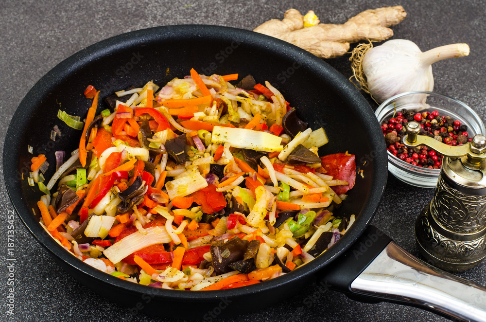 Vegetables with ginger in frying pan