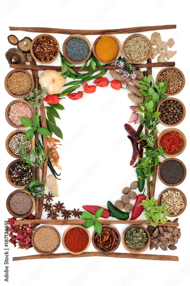 Abstract herb and spice border with fresh and dried herbs and spices with cinnamon sticks creating a frame On white background, top view. Abstract herb and spice border with fresh and dried herbs and spices with cinnamon sticks creating a frame On white background, top view.