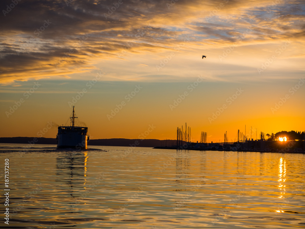Big passanger ship sailing into the sunset. Big passanger ship sailing into the sunset.