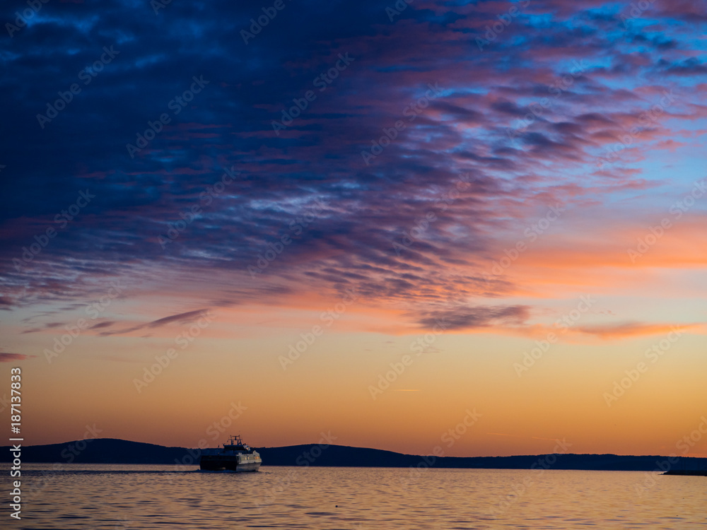 Ship sailing into the sunset