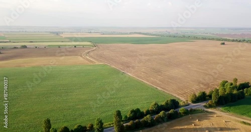 Aerial shot of fields with various types of agriculture. Farming. Aerial shot of farmland. Aerial shot of agricultural fields. View of agricultural Fields crops harvest. Rural Landscape. Counrtyside photo