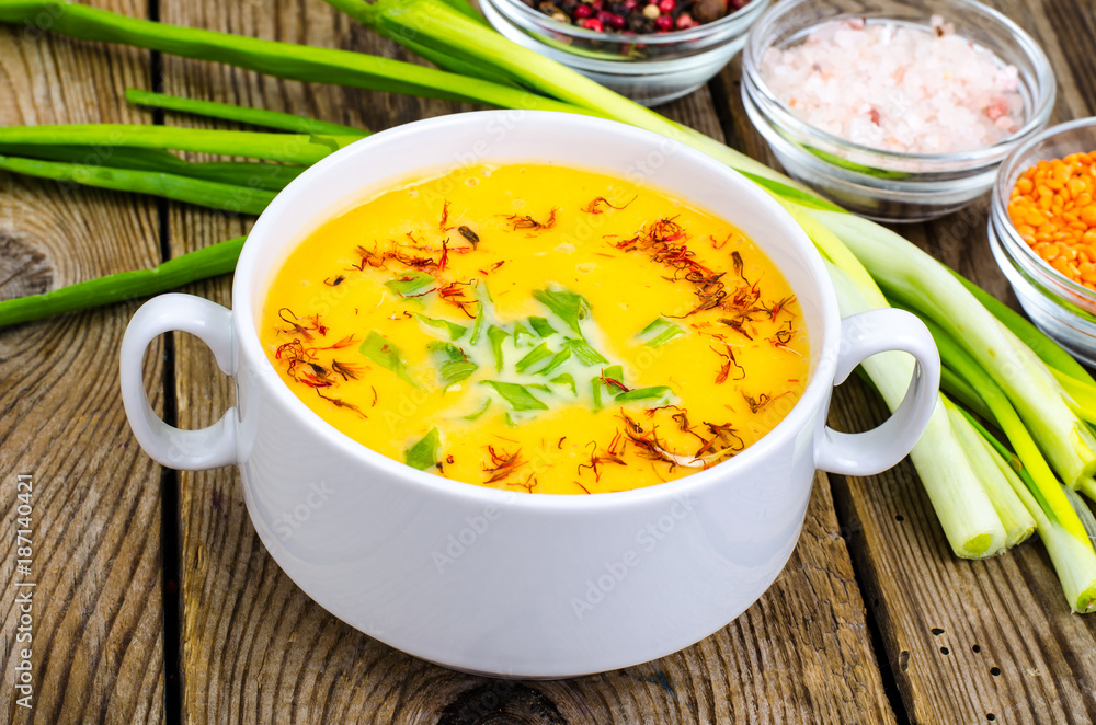 Pumpkin soup with fresh green onion Pumpkin soup with fresh green onion
