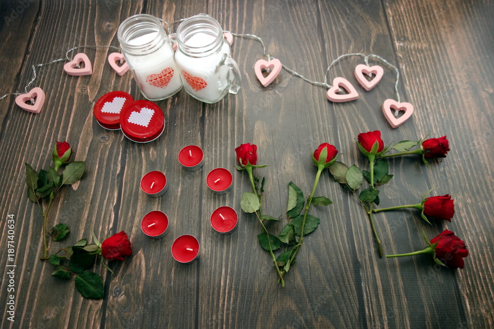 Love word from roses and romantic decorations on wooden background, valentines day concept