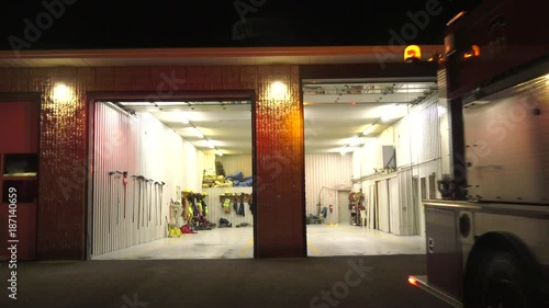 fire fighter truck leaves fire station garage empty at night 4k