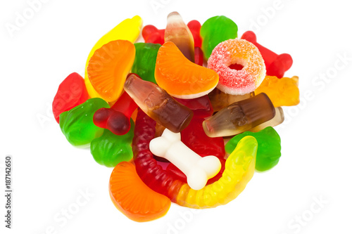 The colored fruit jelly sweets on white background
