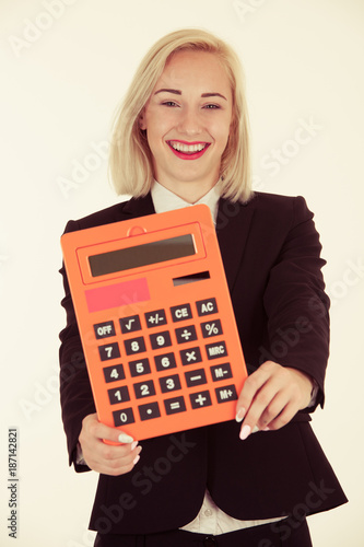 attractive accountant - beautiful blonde business woman hlding a calculator isolated over white photo