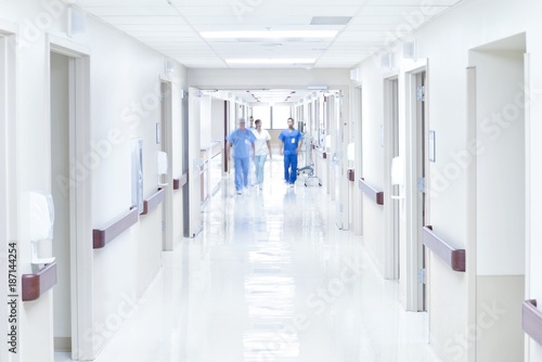 Doctors walking down hospital corridor