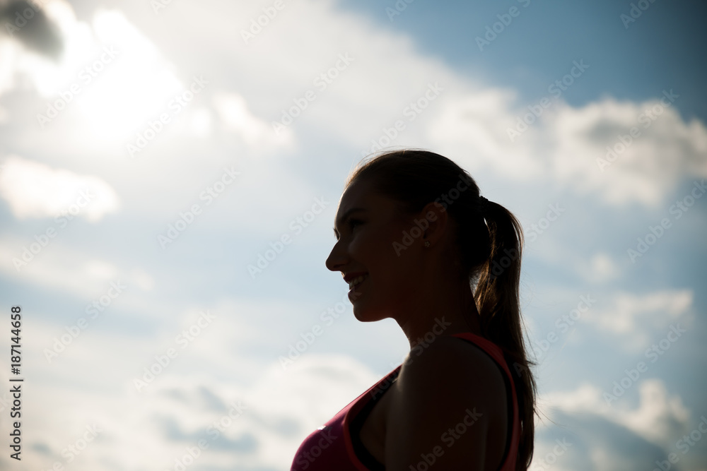 Silhouette of a beautiful young woman hiking the mountains Silhouette of a beautiful young woman hiking the mountains