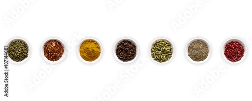 Dried spices in small bowls photo