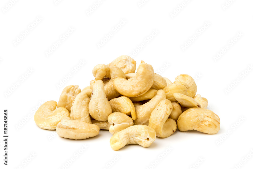 Heap of cashews on a white Heap of cashews on a white
