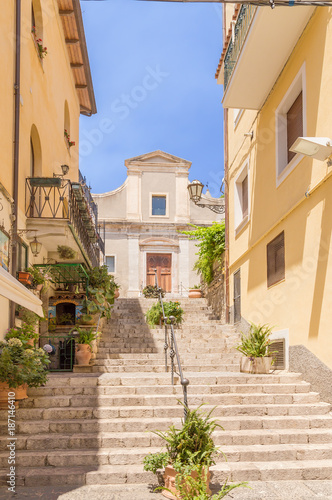 Fototapeta Naklejka Na Ścianę i Meble -  Taormina, Sicily, Italy. A colorful street in the historical center