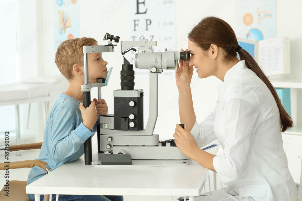 Naklejka premium Cute little child at ophthalmologist's office