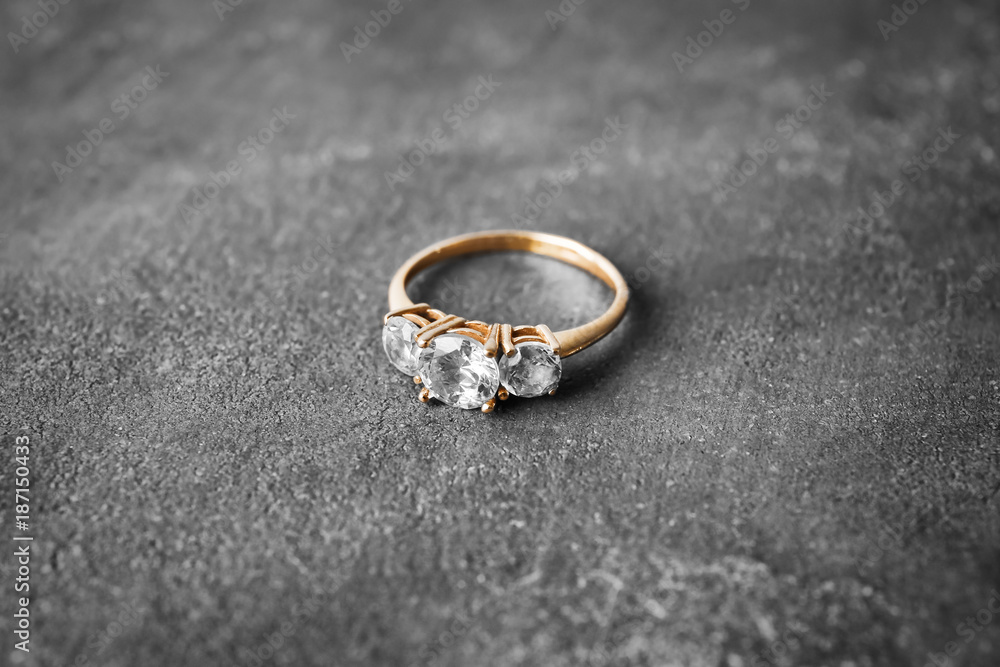 Beautiful engagement ring on gray background Beautiful engagement ring on gray background