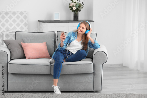 Beautiful woman listening t...