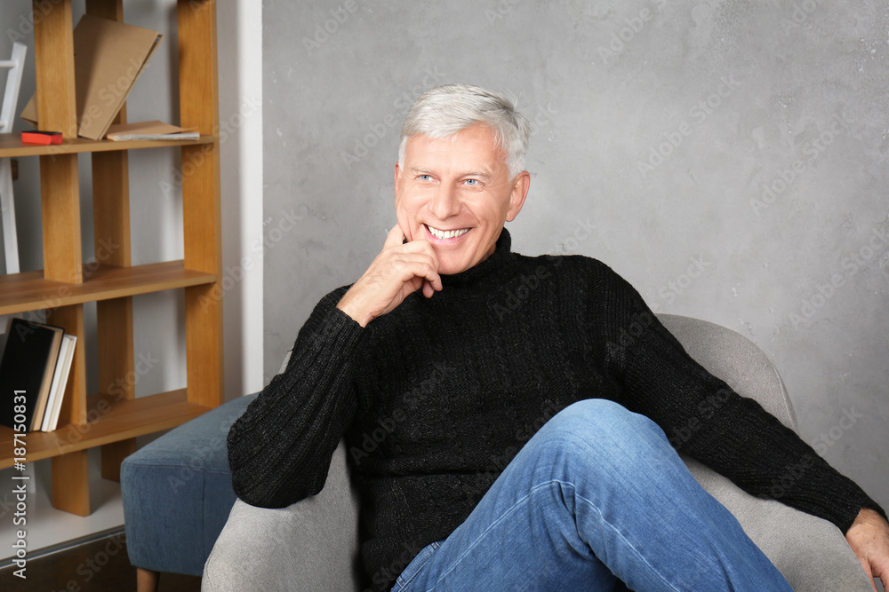 Attractive mature man in casual clothes indoors Attractive mature man in casual clothes indoors