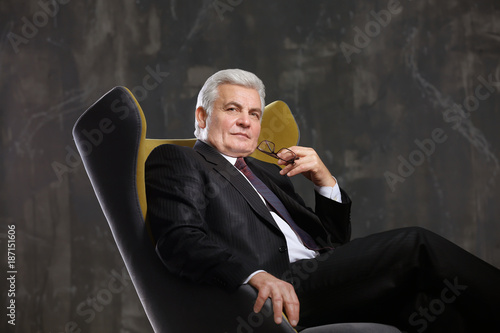 Handsome mature man sitting...