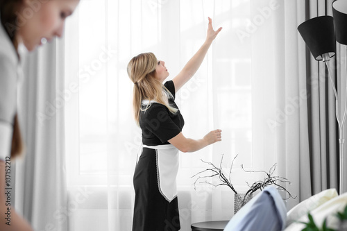 Young chambermaid in unifor...