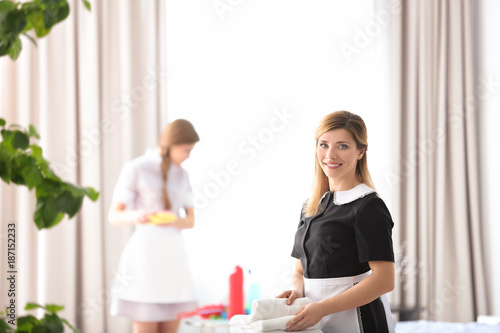Young chambermaid in unifor...