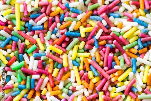 Closeup of a pile of colourful sugar sprinkles (cake decor), from above