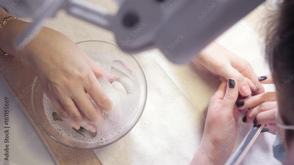 Manicure beauty salon. manicurist makes the procedure for the care of ...