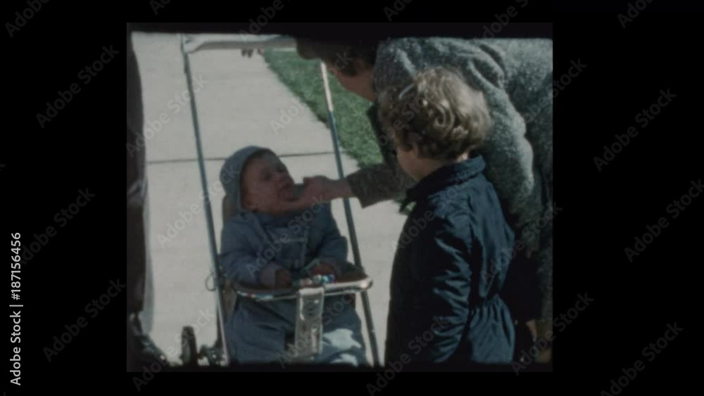 1960 Woman plays with babys cheeks 1960 Woman plays with babys cheeks