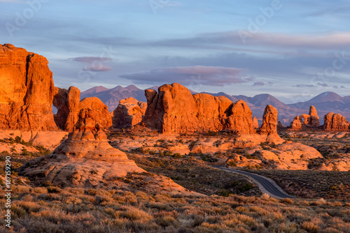 Utah Sunset - Red Rock Formations In Arches National Park, Utah. The LaSalle Mountains in the Background.