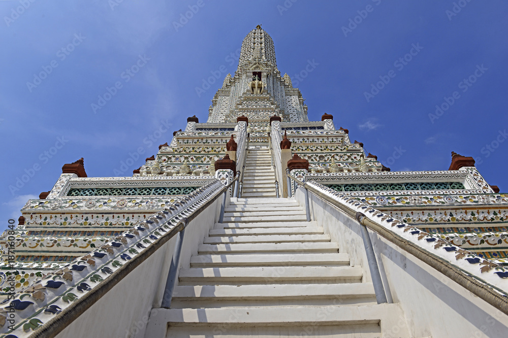 Porcelain covered traditional Khmer architecture of temples and pagodas at Wat Arun or Temple of Dawn on the Chao Phraya River in Bangkok Thailand