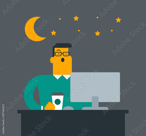 Young caucasian white sleepy tired office worker holding a cup of coffee and yawning while working in the office at night