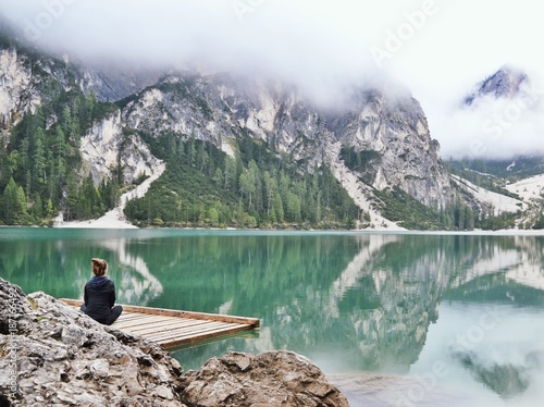 Fotografija Person meditating on a lake
