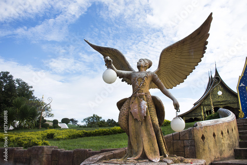 Kinnaree angel statue and lighting at Wat phu prao in Sirindhorn District in Ubon Ratchathani, Thailand photo