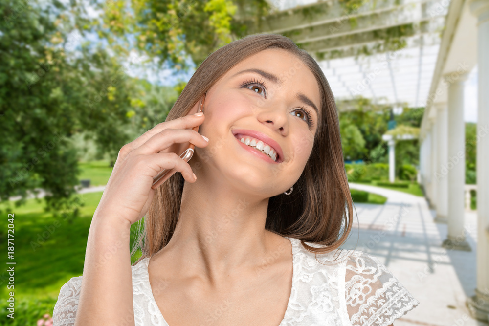 Young elegant woman talking on mobile phone Young elegant woman talking on mobile phone
