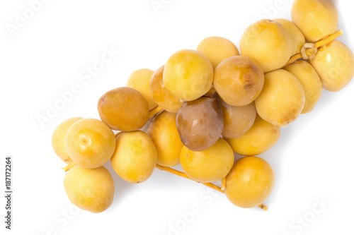 yellow raw dates isolated on white background