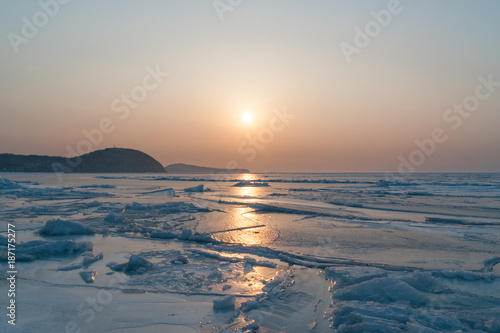 Sunset above iced sea