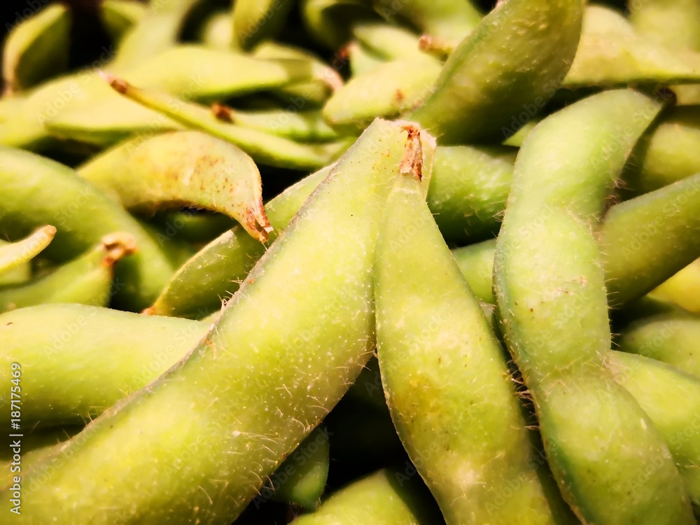 For nylig udkast grinende Edamame is pigeon peas, which is the one type of Japaneses pea. That have  green pods and outer skin covering with hair. Must be boiled before eating.  Stock Photo | Adobe Stock
