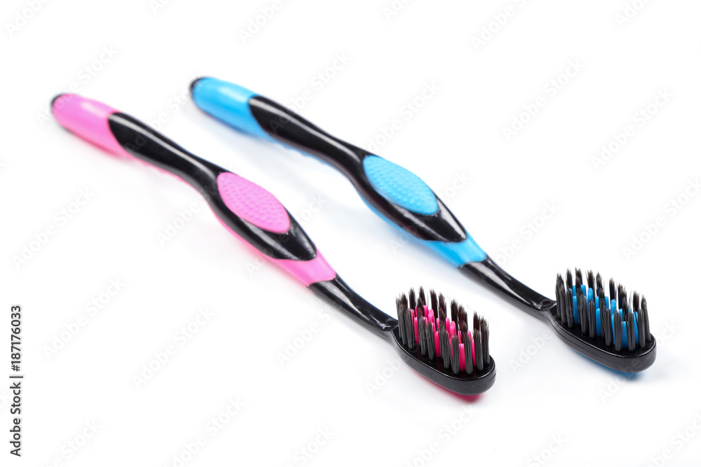 Two toothbrushes Black and pink black and blue isolated white background. Two toothbrushes Black and pink black and blue isolated white background.