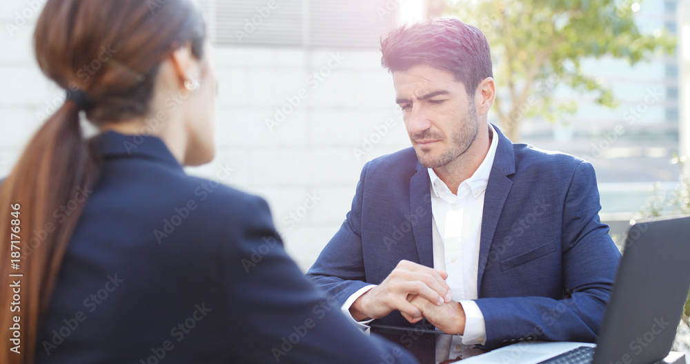 Business people discuss together on laptop computer Business people discuss together on laptop computer
