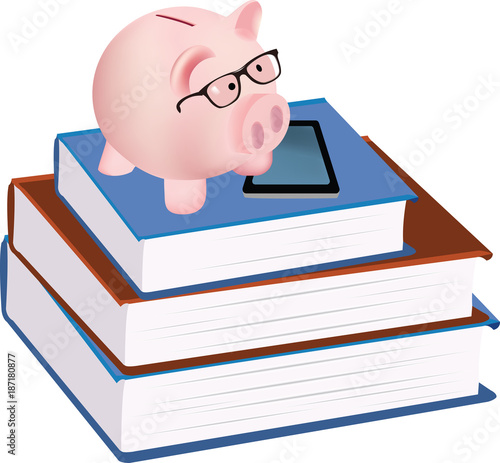 salvadanaio forma maialino sopra a dei libri