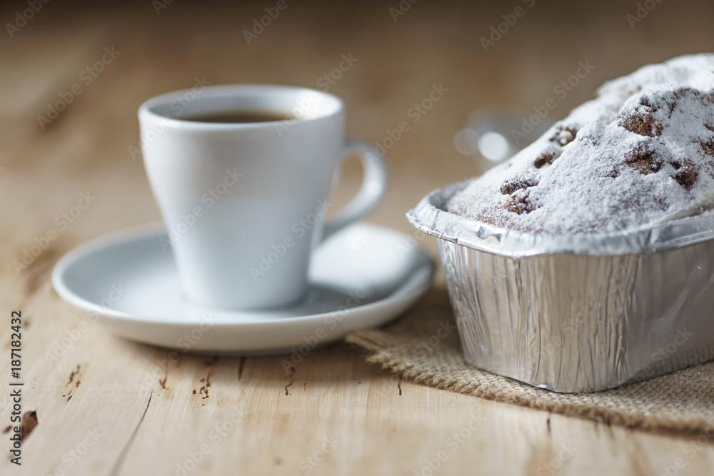 Coffee cup and cake with raisins on wooden desk Coffee cup and cake with raisins on wooden desk