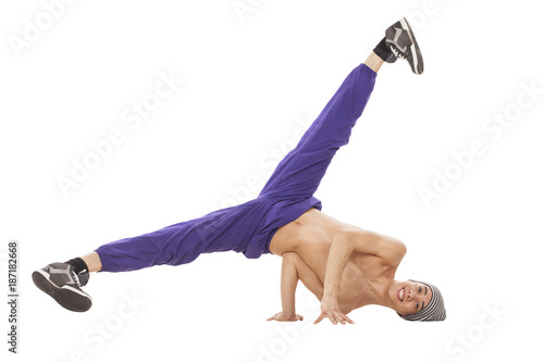Young topless dancer sitting on his head with legs up and apart