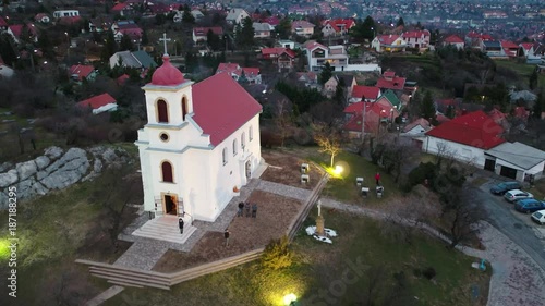 aerial shoot from white church at evening photo