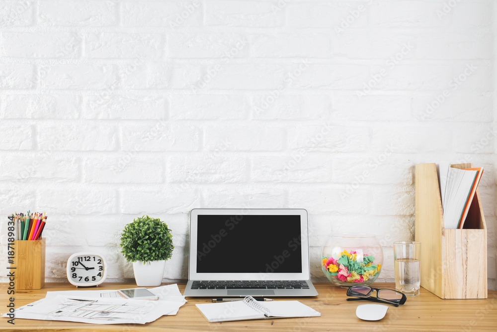 Creative designer workspace with blank laptop Creative designer workspace with blank laptop