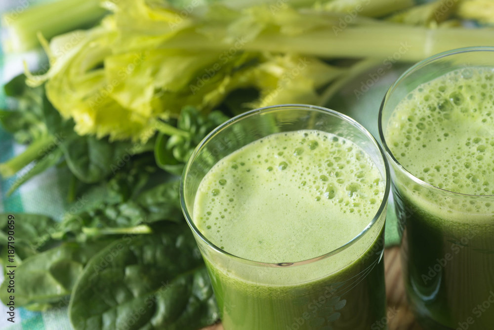 fresh green spinach leaves and celery juice fresh green spinach leaves and celery juice