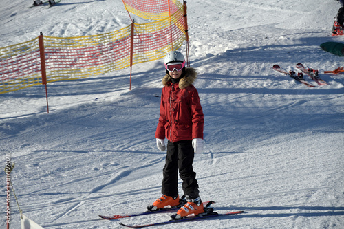 Girl learns to ski with ski instructor